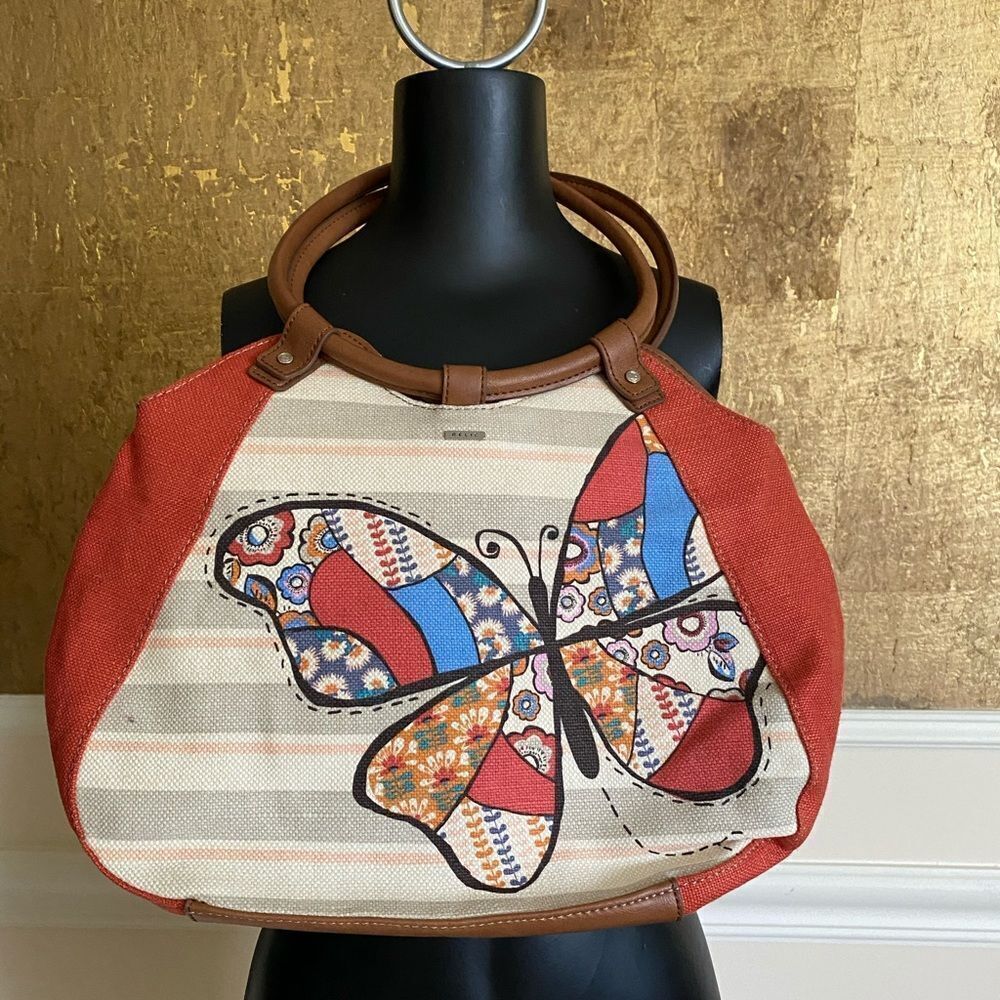 RELIC tan canvas ring handle butterfly handbag